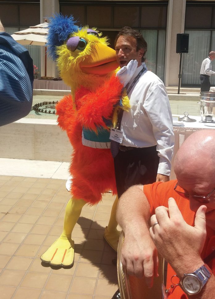 Phil Kaplan gets a peck from the San Diego Chicken.